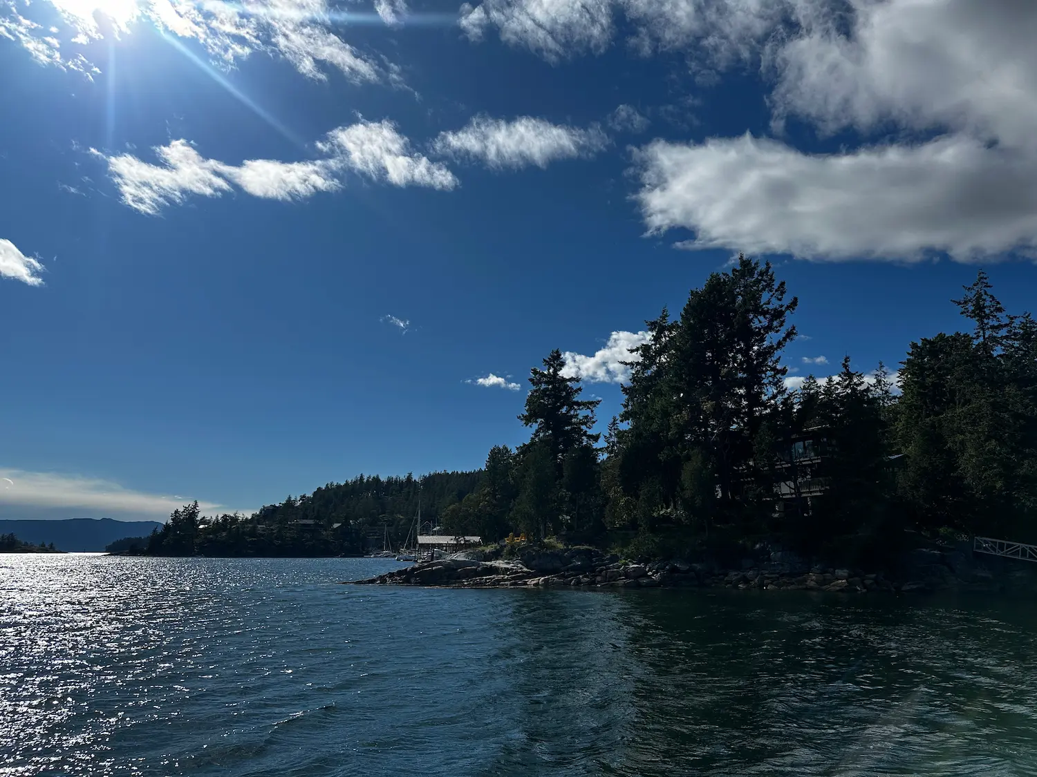 Golden-hour light over the forested shores of Pender Harbour, BC
