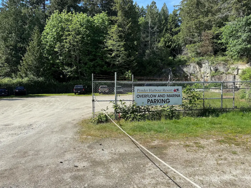 Fenced customer overflow parking at the entrance to Pender Harbour Resort